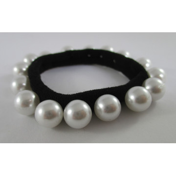 Faux pearls on black...