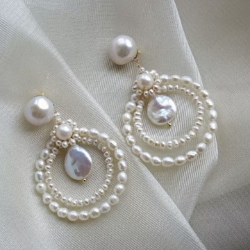 Natural pearl studs with...