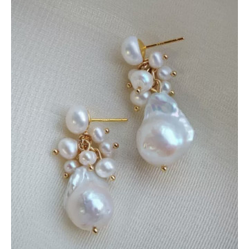 Natural pearl studs with...