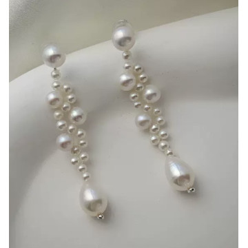 Natural pearl studs with...