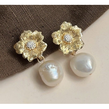 Gold flower studs with drop...